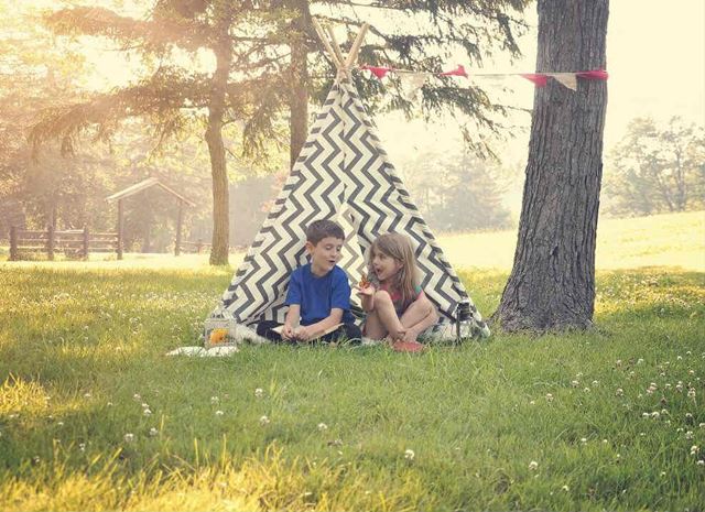 Two kids glamping on a sunny day